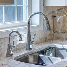 Warm-Creamy-White-Painted-Cabinetry-Paired-Organic-Wood-Grained-Timber-Kitchen-Remodel-in-East-York 2